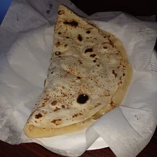 a piece of flat bread on a napkin