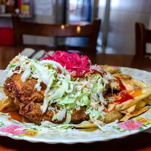 Pollo con Tajadas (fried chicken with fried banana chips) $16