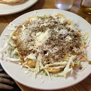 a plate of pasta with meat and cheese