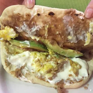 Baleada with beans, egg, avocado, and cream