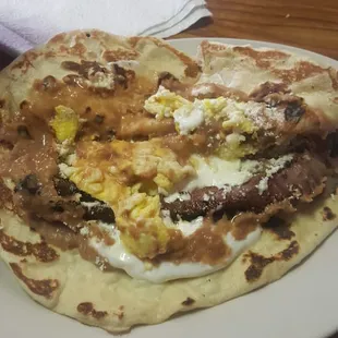 Carne asada with egg, cheese and brands worth b hand made for tortillas