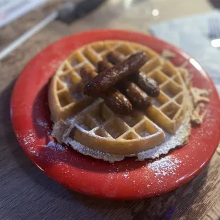 a waffle on a red plate