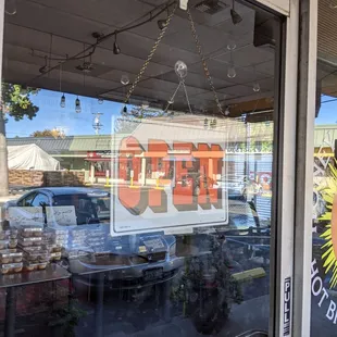 The open sign but locked door during business hours