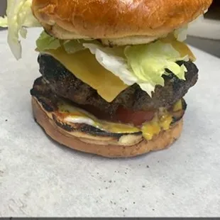 BBQ Johnson's signature murder burger.  A build your own burger and true country classic.  This burger has bell pepper, onions, and more!