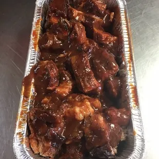 Third Pan of rib tips with your choice of mama's knockout hot or mild bbq sauce