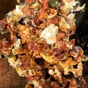 Huevos com chorizo , served with arroz frijoles y crema + tortillas