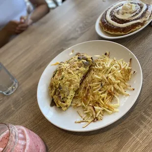 Strawberry banana smoothie, make your own omelet with hashbrowns and cinnamon roll pancakes.