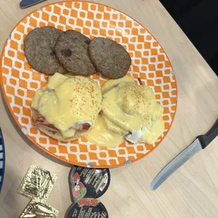 Classic Benedict with side of sausage patties.