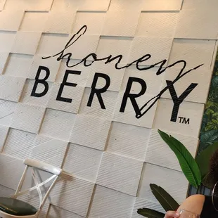  a woman holding a glass of wine