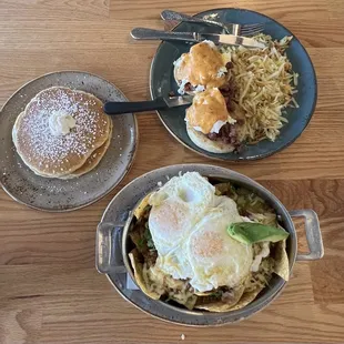 Housemade corned beef Benedict, chorizo chilaquiles skillet with a side of pancakes