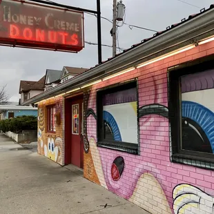 a neon sign for a donut shop