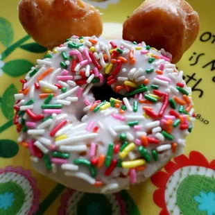 a donut with sprinkles on a plate