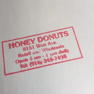 a red stamp on a white box