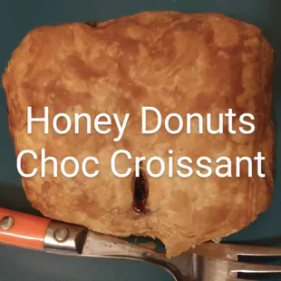 a piece of croissant on a fork