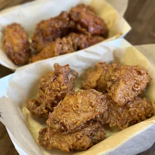 two baskets of fried chicken