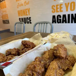 two baskets of fried chicken