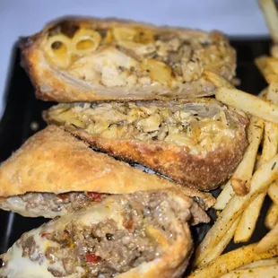 Steak and cheese and the Mac n cheese jerk chicken egg rolls was so amazing 10/10