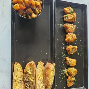 Home fries, jerk and mac n cheese Egg rolls, and salmon bites