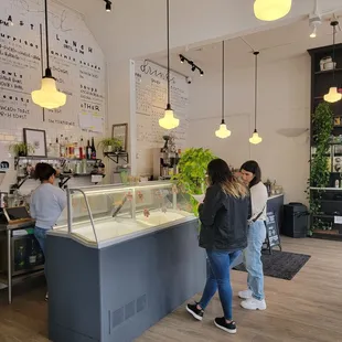 two people standing in front of the counter