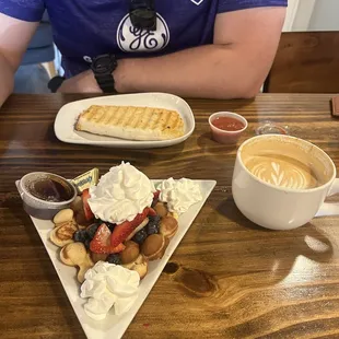 Red white and blue waffle with hot vanilla latte and breakfast burrito!