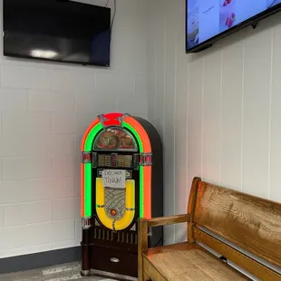 a juke box and bench