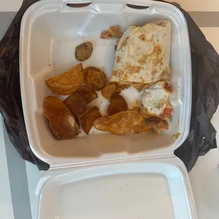 a meal in a styrofoam container