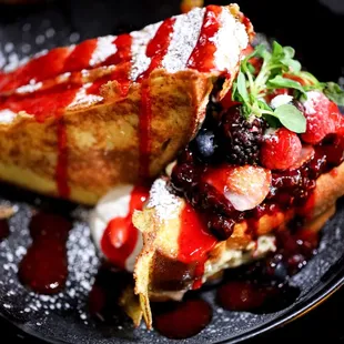 a crepe with berries and cream