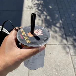 a person holding a cup of coffee