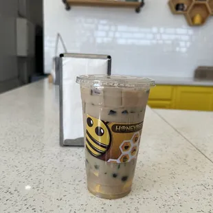 a cup of iced coffee on a counter