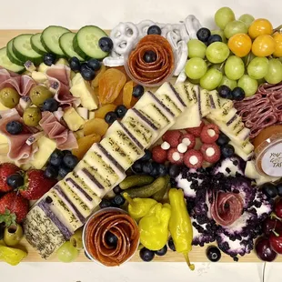 a platter of fruit and cheese