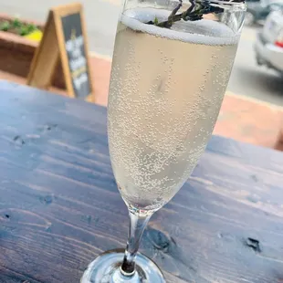 a glass of champagne on a table