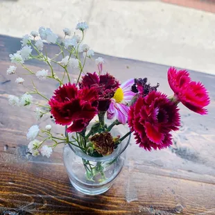 a vase of flowers on a table