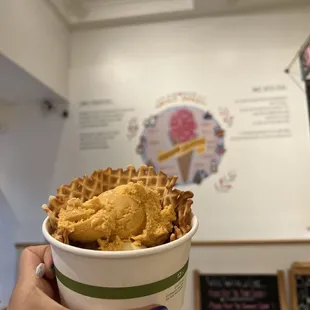 Thai iced tea ice cream in a waffle bowl