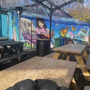 Covered seating, might be another food truck where the art was done.