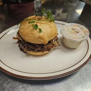 BBQ pulled pork on a Gluten Free Bun! Coleslaw as a side. What a pair!