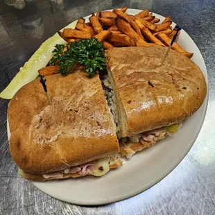 Our famous Cuban Sandwich. Sweet potato fries pictured.