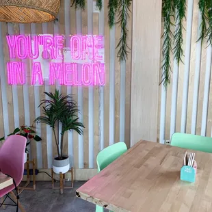 pink neon sign that says you&apos;re one in a million