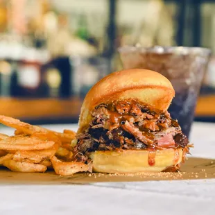 a pulled pork sandwich and french fries