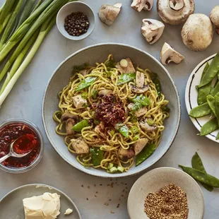 a bowl of noodles with mushrooms and other ingredients