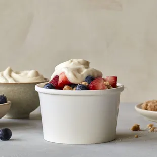 a bowl of yogurt with berries and granola