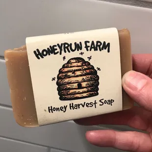 a hand holding a bar of soap