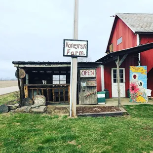 a red barn with a sign that says honeyrun farm
