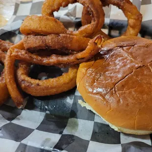 Slawburger with onion rings.