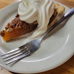 Pecan pie with soft ice cream swirled on top.