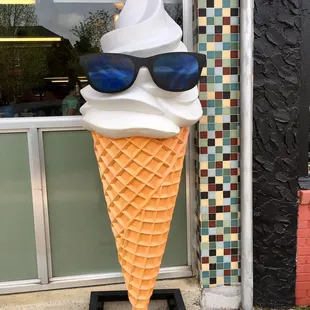 People love to have their photo taken with this &quot;cool cone in front of Honey&apos;s.