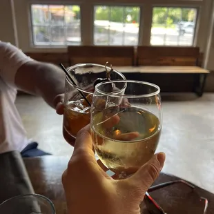 a person holding a glass of wine