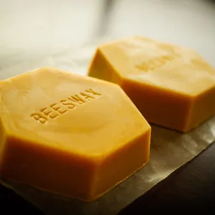 two pieces of cheese on a piece of wax paper