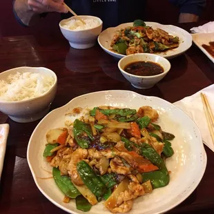 Chicken and snow peas with garlic sauce; garlic chicken in the back
