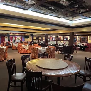 a dining area with tables and chairs