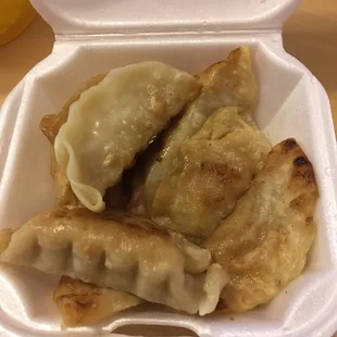Fried dumplings. Lost the crispness in the packaging but still tasty.